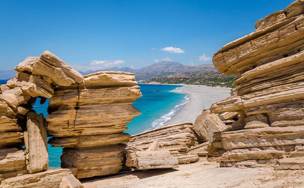 The-long-sandy-beach-of-Triopetra-with-its-layered-rocks