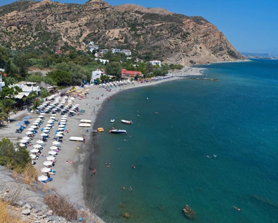 Beach-with-taverns-parasols-and-blue-sea